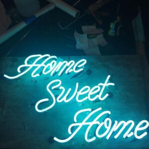 A neon sign that says home sweet home.