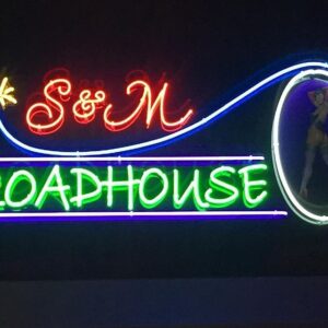 A neon sign for the s & m roadhouse.